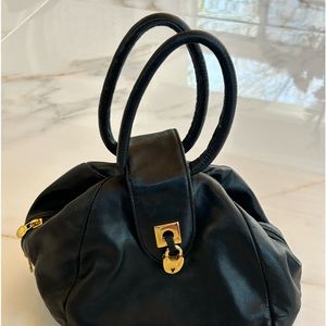 Carolina Herrera Stylish Black Hand bag with metal closing snap and hand straps